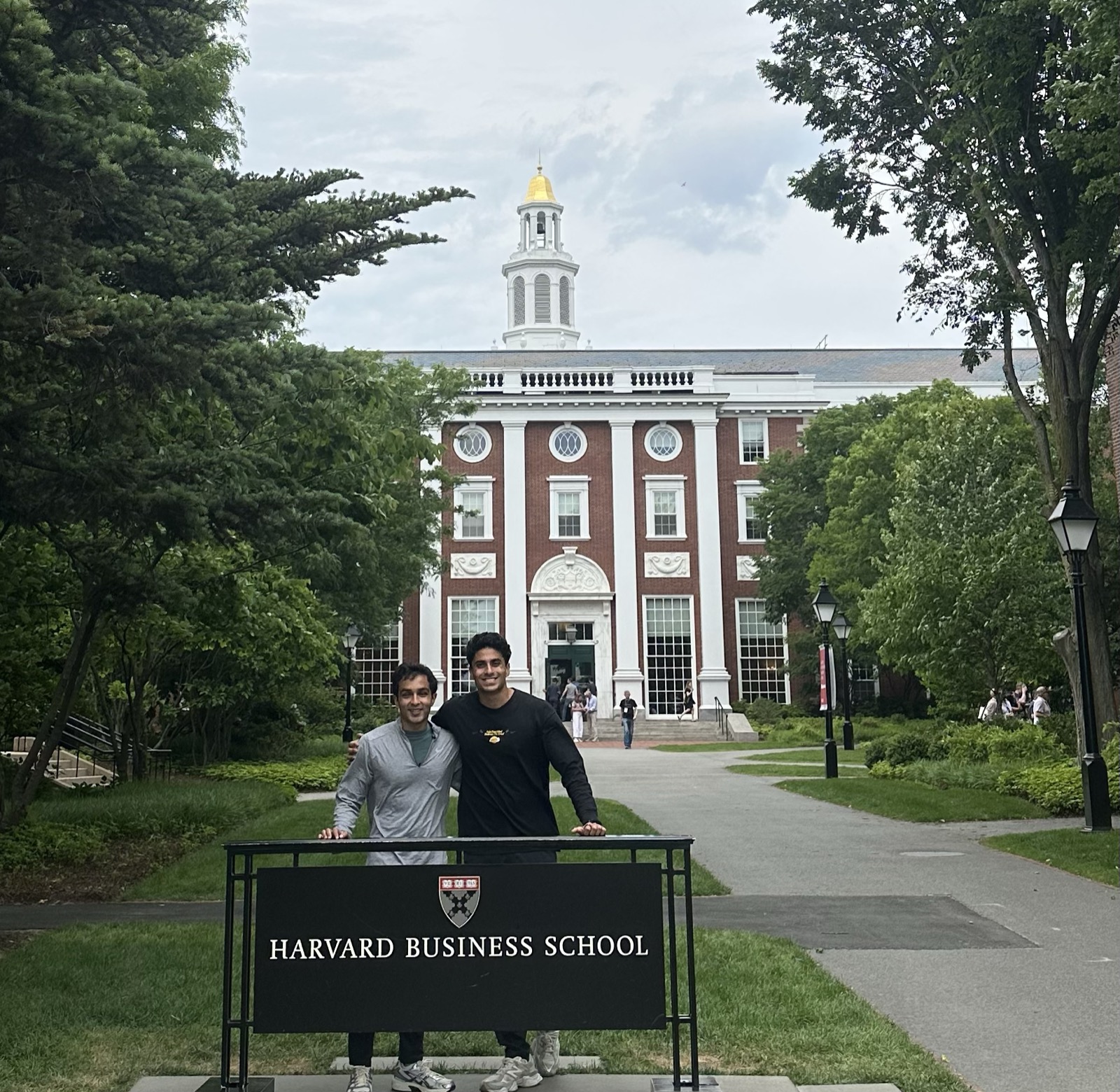 Dilan and Krishan in front of Harvard Business School